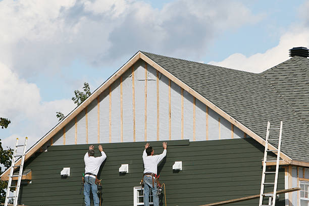 Professional Storm Damage Siding Repair technician working in Scottsville, NY
